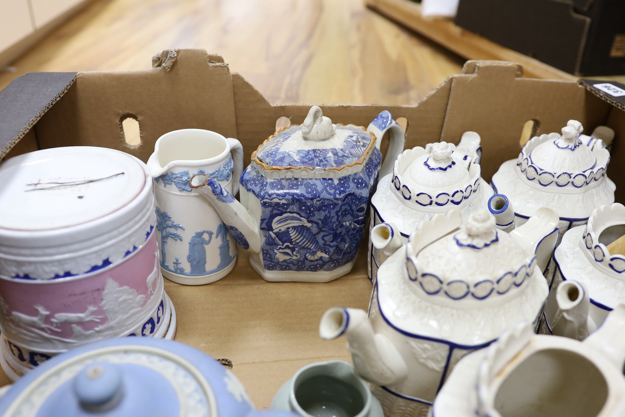 A quantity of various teapots including a pearlware teapot with swan finial, Castleford types, one Wedgwood